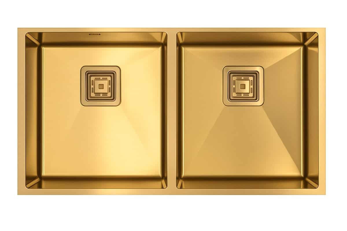 Luxury gold kitchen sink with dual basins and modern square drain designs for high-end kitchen remodels and premium cooking spaces.